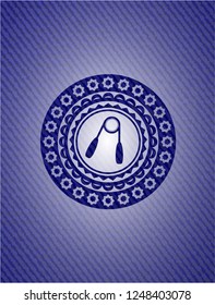 hand gripper icon inside jean or denim emblem or badge background