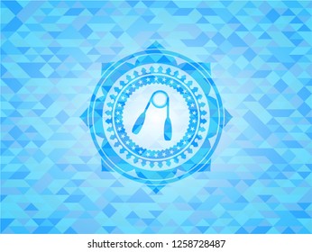hand gripper icon inside light blue emblem with triangle mosaic background