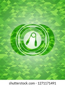 hand gripper icon inside realistic green emblem. Mosaic background