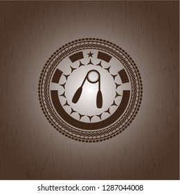 hand gripper icon inside realistic wood emblem