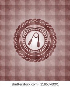 hand gripper icon inside red seamless badge with geometric pattern background.