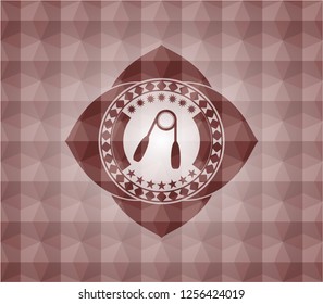 hand gripper icon inside red seamless emblem with geometric background.