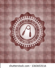 hand gripper icon inside red seamless badge with geometric background.