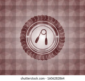 hand gripper icon inside red seamless emblem with geometric background.