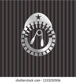 hand gripper icon inside silver emblem