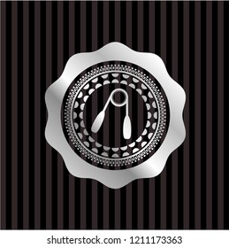 hand gripper icon inside silvery badge or emblem