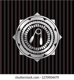 hand gripper icon inside silvery emblem or badge