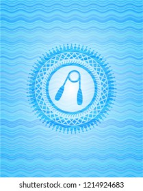 hand gripper icon inside sky blue water wave badge background.