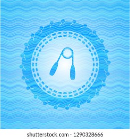 hand gripper icon inside water concept badge background.