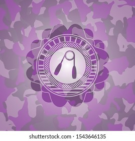 hand gripper icon on pink camouflaged texture