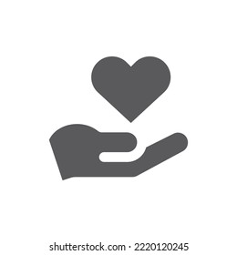 Hand und Herz schwarze Vektorsymbol. Hilfeleistung oder Freiwilligendienst gefülltes Symbol.
