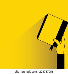 hand held up book on yellow background, flat and shadow theme