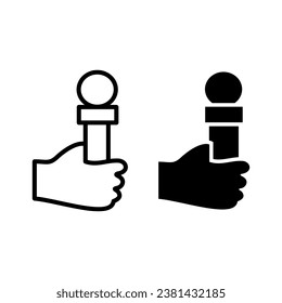 
Hand held microphone outline and black filled icon. isolated on white background.
