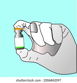 Hand held new variant covid 19 vaccine bottle on light blue background