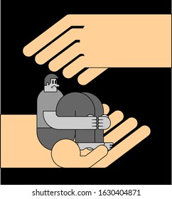 Hand helps Lonely man in depression. Unhappy guy sitting and hugging her knees. Depressed male. Concept of support Loneliness and stress