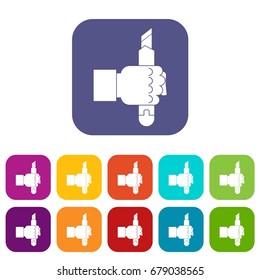 Hand hoding construction utility knife icons set vector illustration in flat style In colors red, blue, green and other