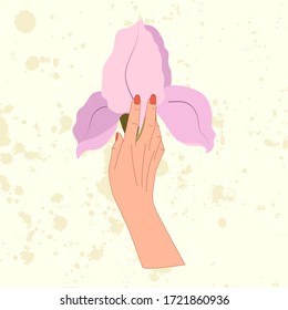 Hand hold big lilac iris flower. Beautiful spring wedding flowers. Beauty concept.