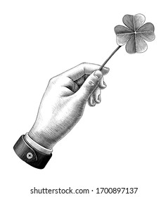 Hand hold clover leaf drawing vintage style black and white clipart isolated on white background