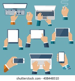 Hand Hold Devices Electronics. Set Computer Devices In Hand Man. Laptop, Tablet, Smartphone, Mobile Phone, Computer, Keyboard, Mouse. Vector Flat Design. Icon Technology Device. Gadget Hands.