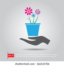 hand hold  flowerpot and plant vector icon