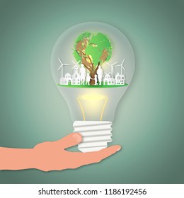 Hand hold the happy family with house on summer, fresh air in the park in the light bulb as nature, healthy, paper art and craft style concept. vector illustration.