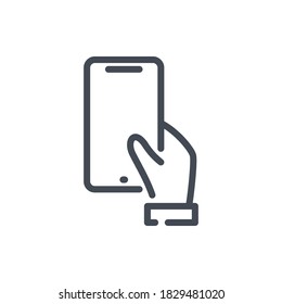 Hand hold mobile phone line icon. Holding a smartphone vector outline sign.