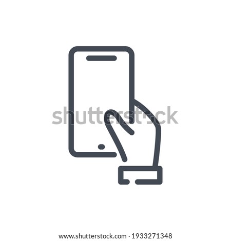 Hand hold mobile phone line icon. Hand holding smartphone vector outline sign.