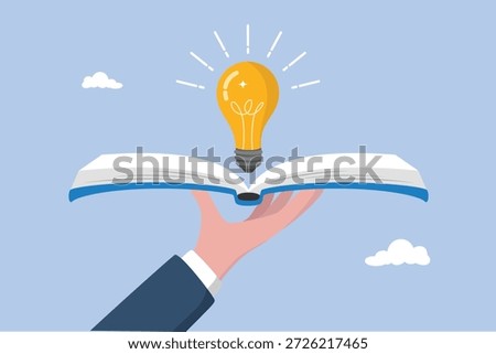 Hand hold open book to discover lightbulb idea, wisdom concept, reading book for inspiration, knowledge or education, study or learning new skill, creativity or idea, discover solution or literature.