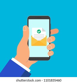 Hand hold phone with envelope document paper sheet  page check mark tick and text icon sign vector illustration. Symbol of email delivery, verification flat design concept isolated on blue background.