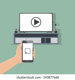 hand hold phone streaming video on phone to tv monitor on wireless