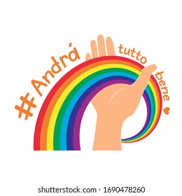 Hand hold rainbow for hope and wish. italian slogan: Andra tutto bene. Everything will be fine written in Italian. Motivational phrase in Italian used during quarantine in fighting with COVID-19.