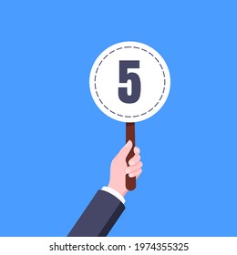 Hand hold round score card banner plate with number 5 business concept flat style design vector illustration. Votes jury judges of tournament or contest.