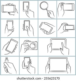 hand hold smartphone and tablet, touching on tablet