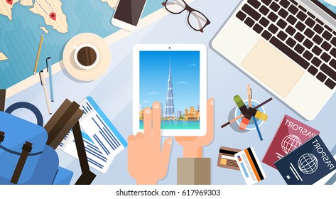 Hand Hold Tablet Computer With Dubai Skyline Panorama, Traveler Workplace With Passports Top Angle View Flat Vector Illustration