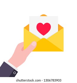 Hand hold yellow envelope letter with heart on it. E-mail concept love message or sms flat style design vector illustration isolated on white background. Message or sms delivering and notification.