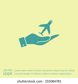 hand holding a airplane symbol . icon of air travel