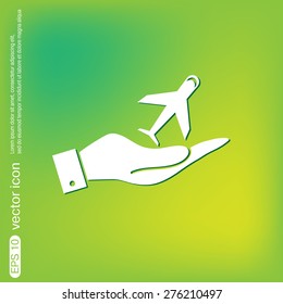 hand holding a airplane symbol . icon of air travel
