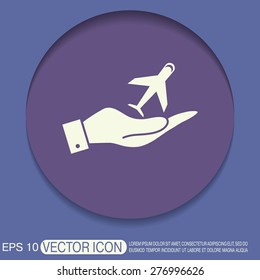 hand holding a airplane symbol . icon of air travel