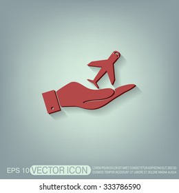 hand holding a airplane symbol . icon of air travel