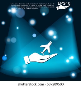 hand holding a airplane symbol . icon of air travel