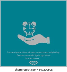 hand holding a alarm clock. Alarm icon . The clock shows the time