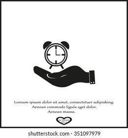 hand holding a alarm clock. Alarm icon . The clock shows the time