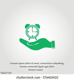 hand holding a alarm clock. Alarm icon . The clock shows the time