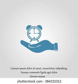 hand holding a alarm clock. Alarm icon . The clock shows the time