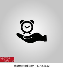 hand holding a alarm clock. Alarm icon . The clock shows the time