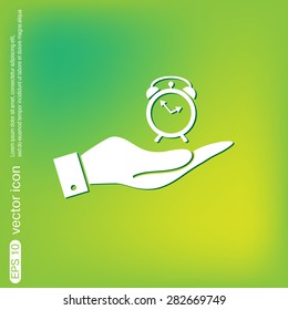 hand holding a alarm clock sign. Symbol morning. Alarm icon . The clock shows the time