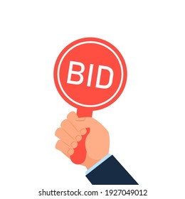 Hand holding auction paddle. Clipart image