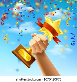 Hand holding award of winner on blue sky background with streamers and confetti realistic vector illustration
