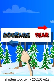 Hand holding up a banner with Courage and fear text with arrows. Man showing billboard, sign.