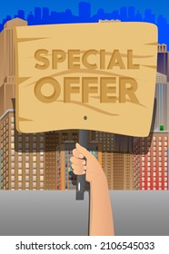 Hand holding up a banner with Special Offer text. Showing billboard banner, sign. Sale, shopping, shop retail business concept.
